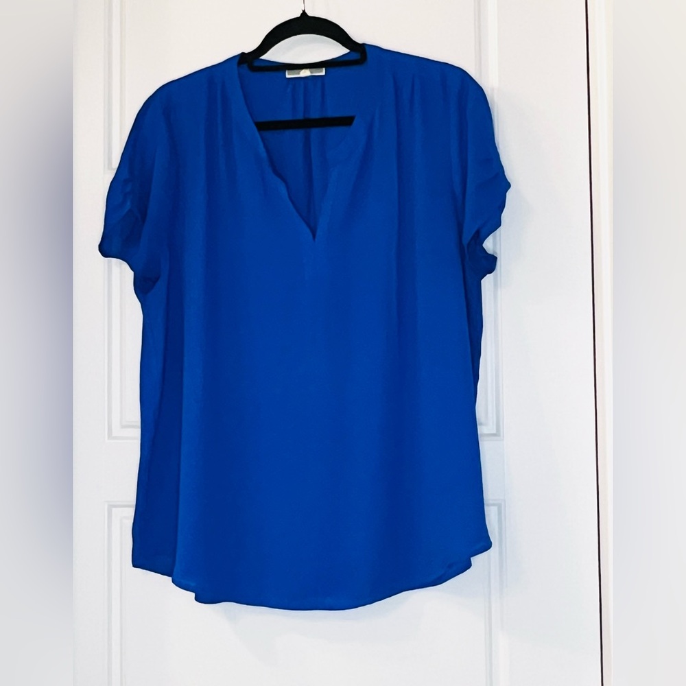 Royal blue top with an accented shoulder seam.